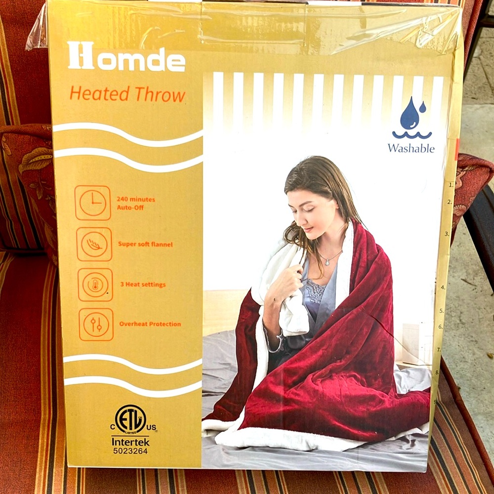 New heated Throw.  New box is sealed.